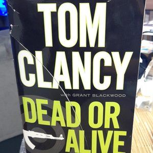 Set of 2 large paperback Tom Clancy Novels.